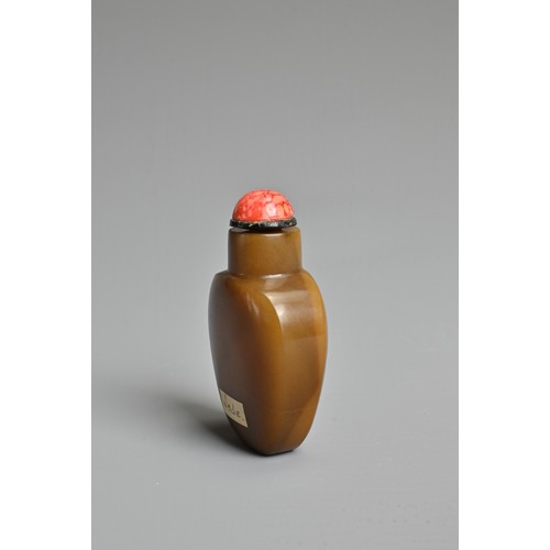 10 - A CHINESE AGATE STONE SNUFF BOTTLE. Of flattened ovoid form carved in relief with peony spray. With ... 