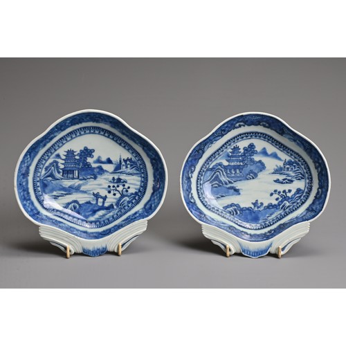 15 - A PAIR OF CHINESE BLUE AND WHITE EXPORT PORCELAIN SHELL DISHES, QIANLONG PERIOD. Each decorated with... 