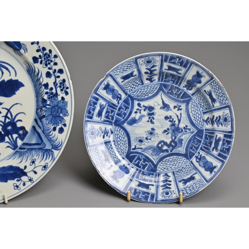 21 - TWO CHINESE BLUE AND WHITE PORCELAIN DISHES, KANGXI PERIOD. Each decorated with various floral scene... 