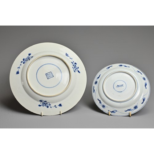 21 - TWO CHINESE BLUE AND WHITE PORCELAIN DISHES, KANGXI PERIOD. Each decorated with various floral scene... 