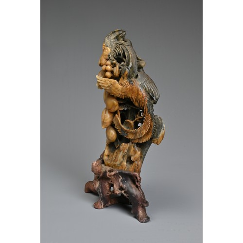 41 - A CHINESE SOAPSTONE CARVING OF BIRDS AND SANDUO, 20TH CENTURY. Carved and pierced with scene of bird... 