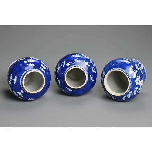 62 - THREE CHINESE BLUE AND WHITE PRUNUS JARS AND COVERS, 19/20TH CENTURY. Each of baluster form with dom... 