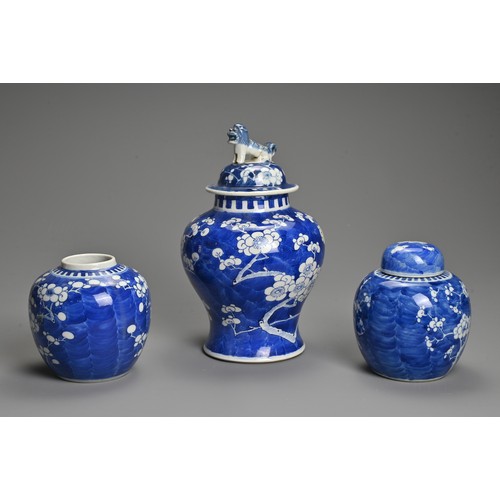 63 - THREE CHINESE BLUE AND WHITE PORCELAIN PRUNUS VASES, 19/20TH CENTURY. To include a baluster form vas... 