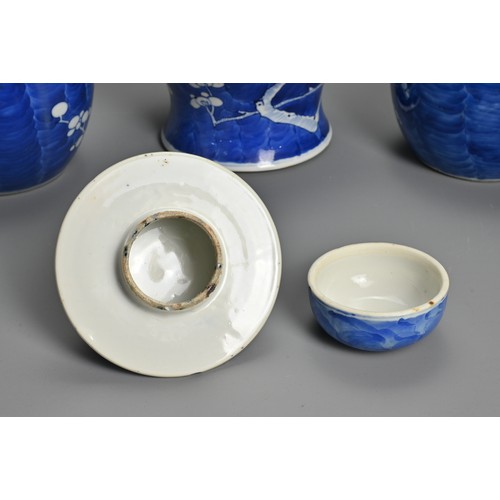 63 - THREE CHINESE BLUE AND WHITE PORCELAIN PRUNUS VASES, 19/20TH CENTURY. To include a baluster form vas... 