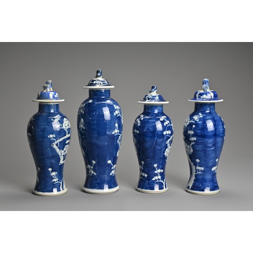 65 - FOUR CHINESE BLUE AND WHITE PORCELAIN PRUNUS VASES AND COVERS, EARLY 20TH CENTURY. Each of tall balu... 