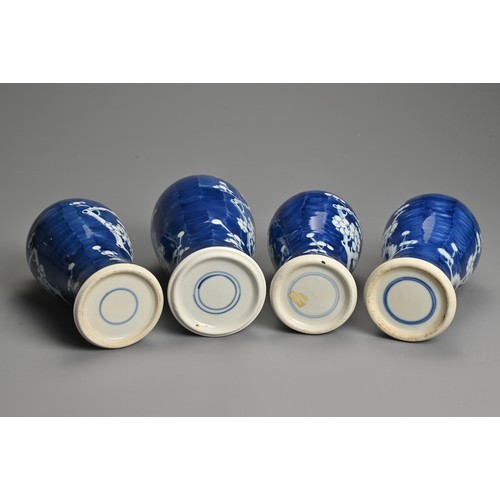 65 - FOUR CHINESE BLUE AND WHITE PORCELAIN PRUNUS VASES AND COVERS, EARLY 20TH CENTURY. Each of tall balu... 