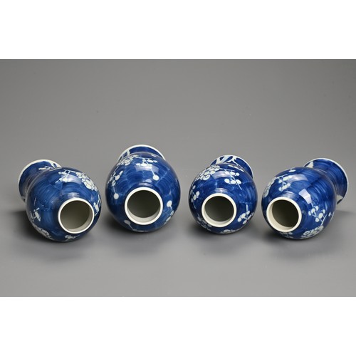 65 - FOUR CHINESE BLUE AND WHITE PORCELAIN PRUNUS VASES AND COVERS, EARLY 20TH CENTURY. Each of tall balu... 