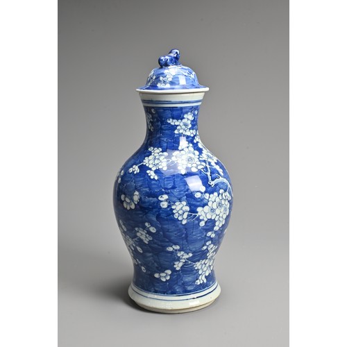 66 - A LARGE CHINESE BLUE AND WHITE PORCELAIN PRUNUS VASE, LATE 19TH CENTURY. Of baluster form with lion ... 