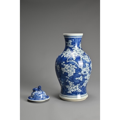 66 - A LARGE CHINESE BLUE AND WHITE PORCELAIN PRUNUS VASE, LATE 19TH CENTURY. Of baluster form with lion ... 