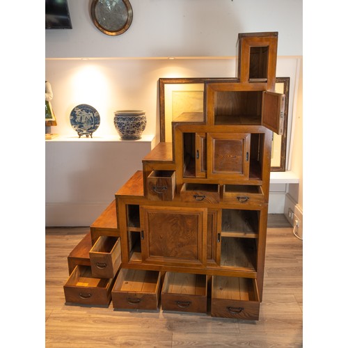 205 - EARLY 20TH CENTURY JAPANESE/KOREAN ELMWOOD STEPPED CABINET, in two sections, top faux drawer above a... 