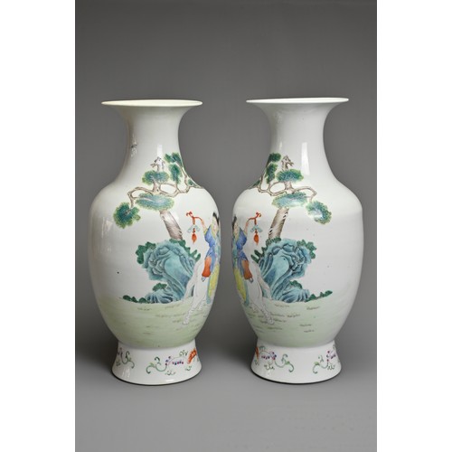 89 - A MIRRORED PAIR OF CHINESE FAMILLE ROSE PORCELAIN VASES, 20TH CENTURY. Decorated with children sat o... 