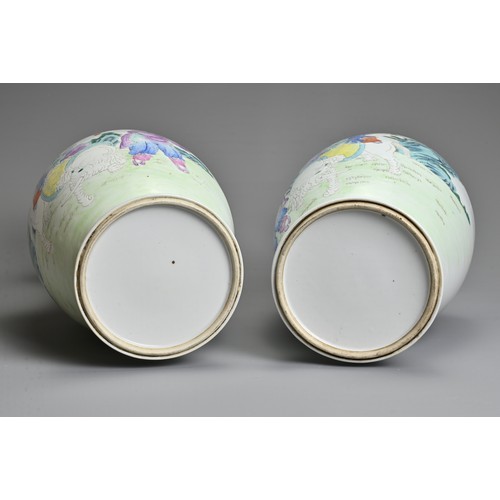 89 - A MIRRORED PAIR OF CHINESE FAMILLE ROSE PORCELAIN VASES, 20TH CENTURY. Decorated with children sat o... 