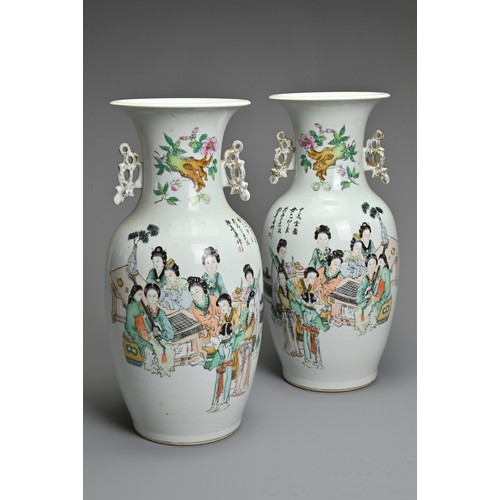 90 - A MIRRORED PAIR OF CHINESE FAMILLE ROSE PORCELAIN VASES, 20TH CENTURY. Of baluster form with gilt ha... 