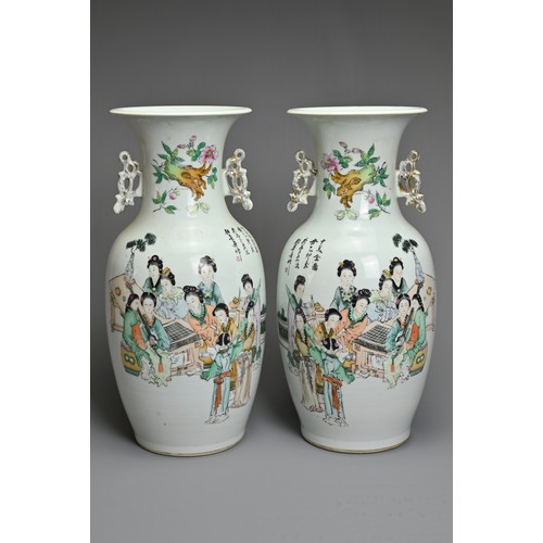 90 - A MIRRORED PAIR OF CHINESE FAMILLE ROSE PORCELAIN VASES, 20TH CENTURY. Of baluster form with gilt ha... 