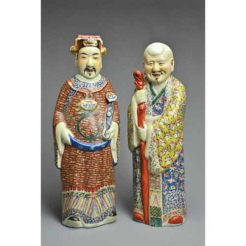 91 - TWO CHINESE POLYCHROME DECORATED PORCELAIN FIGURES, 20TH CENTURY. The Gods of fortune deities dresse... 