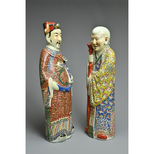 91 - TWO CHINESE POLYCHROME DECORATED PORCELAIN FIGURES, 20TH CENTURY. The Gods of fortune deities dresse... 