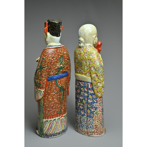 91 - TWO CHINESE POLYCHROME DECORATED PORCELAIN FIGURES, 20TH CENTURY. The Gods of fortune deities dresse... 