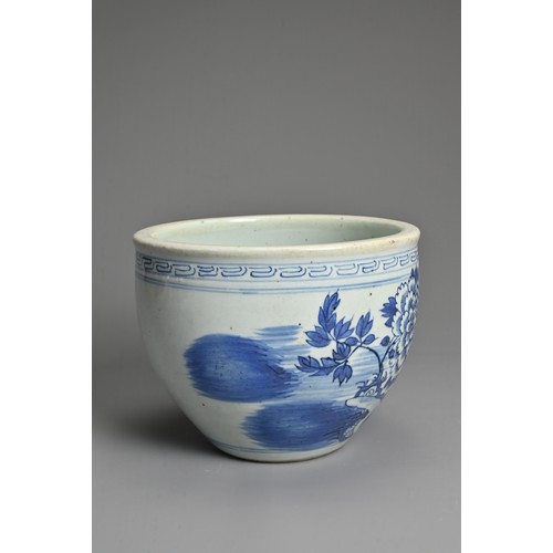 95 - A CHINESE BLUE AND WHITE PORCELAIN JARDINIERE, 19TH CENTURY. Decorated with a garden scene under a b... 