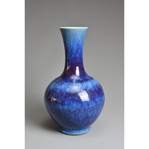 96 - A CHINESE FLAMBE GLAZED PORCELAIN BOTTLE VASE, REPUBLIC PERIOD, EARLY 20TH CENTURY. Globular body wi... 