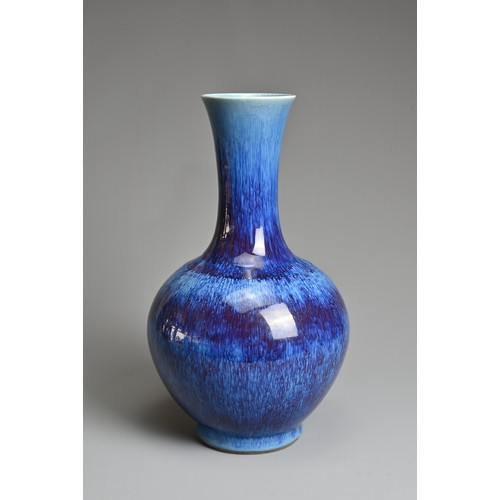 96 - A CHINESE FLAMBE GLAZED PORCELAIN BOTTLE VASE, REPUBLIC PERIOD, EARLY 20TH CENTURY. Globular body wi... 