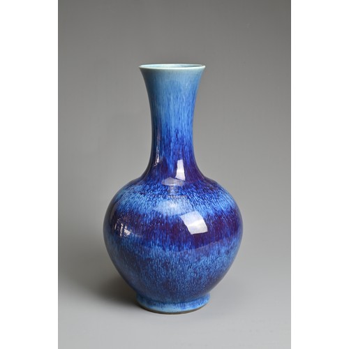 96 - A CHINESE FLAMBE GLAZED PORCELAIN BOTTLE VASE, REPUBLIC PERIOD, EARLY 20TH CENTURY. Globular body wi... 