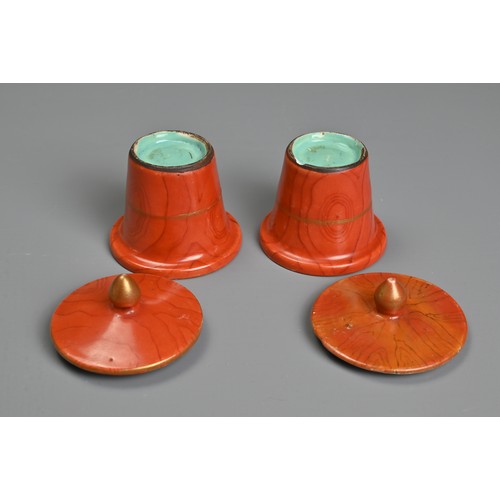 48 - TWO CHINESE CORAL GROUND FAUX BOIS PORCELAIN POTS AND COVERS, 19TH CENTURY. Painted to the exterior ... 