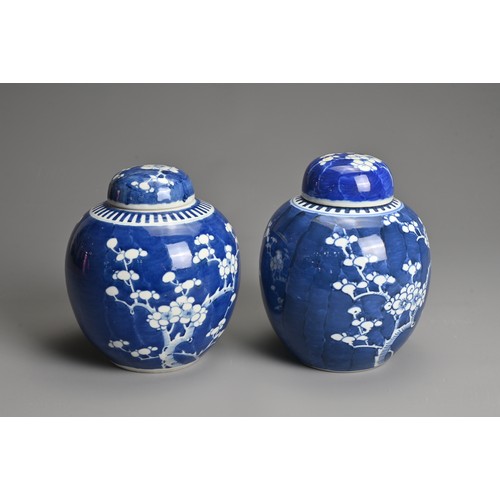 60 - TWO CHINESE BLUE AND WHITE PORCELAIN PRUNUS JARS AND COVERS, 19/20TH CENTURY. Each of globular form ... 