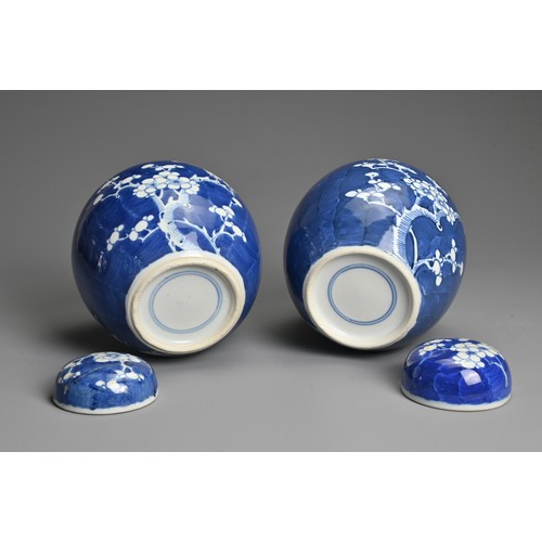 60 - TWO CHINESE BLUE AND WHITE PORCELAIN PRUNUS JARS AND COVERS, 19/20TH CENTURY. Each of globular form ... 