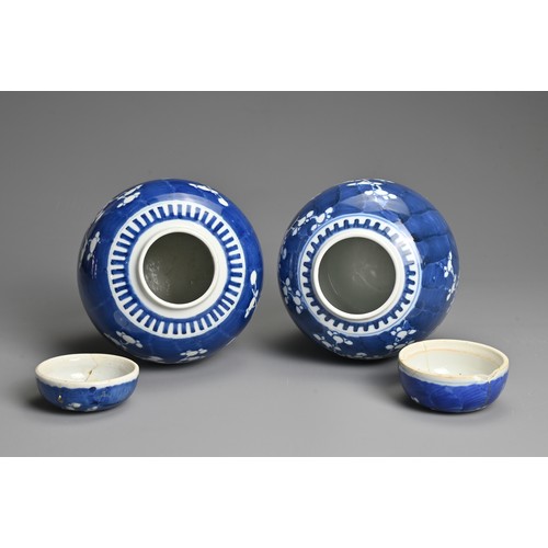 60 - TWO CHINESE BLUE AND WHITE PORCELAIN PRUNUS JARS AND COVERS, 19/20TH CENTURY. Each of globular form ... 