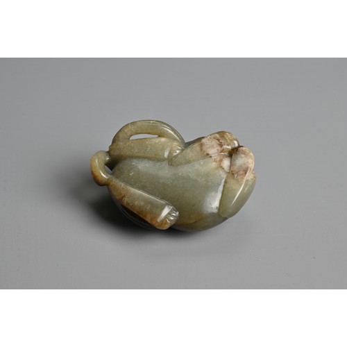 108 - A CHINESE CELADON AND BROWN JADE CARVING OF A BUDDHIST LION, QING DYNASTY. The nephrite jade figure ... 