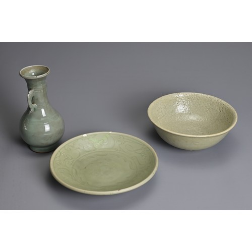 120 - THREE CHINESE CELADON PORCELAIN ITEMS, MING DYNASTY AND LATER. To include a Longquan celadon dish de... 