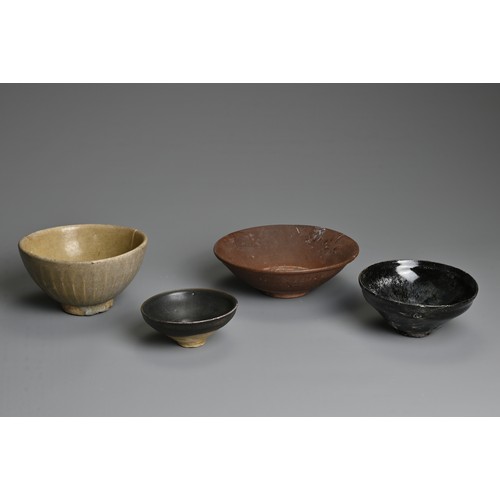 125 - FOUR CHINESE / THAI POTTERY BOWLS. To include a Thai celadon glazed bowl with ribbed sides; A brown ... 