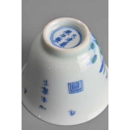 174 - A SMALL CHINESE DOUCAI PORCELAIN WINE CUP, KANGXI MARK. Finely potted, decorated to the exterior wit... 