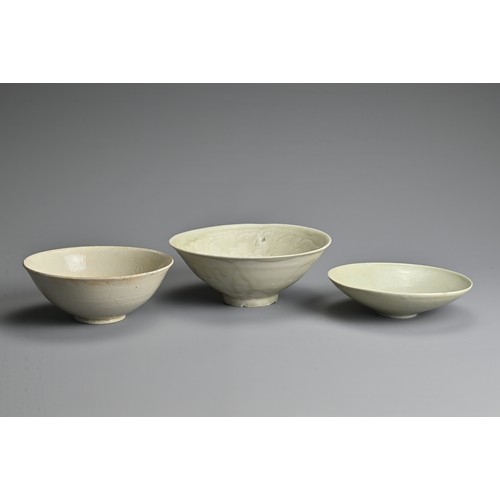 153 - THREE CHINESE QINGBAI WARE BOWLS, SONG / YUAN DYNASTY. Each of varying designs and sizes. The two sm... 