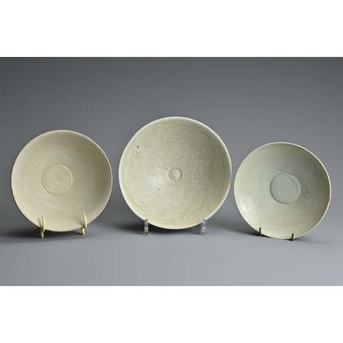 153 - THREE CHINESE QINGBAI WARE BOWLS, SONG / YUAN DYNASTY. Each of varying designs and sizes. The two sm... 