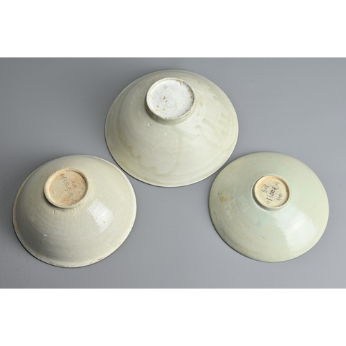 153 - THREE CHINESE QINGBAI WARE BOWLS, SONG / YUAN DYNASTY. Each of varying designs and sizes. The two sm... 