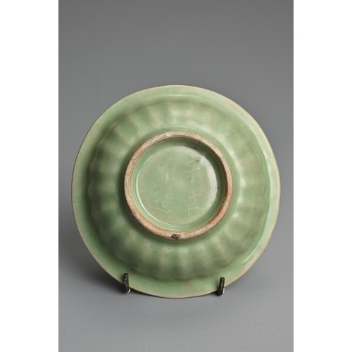 150 - A CHINESE LONGQUAN CELADON TWIN FISH DISH WITH FOUR CHARACTER MARK, YUAN DYNASTY OR LATER. Thickly p... 