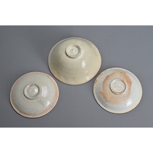 149 - THREE CHINESE QINGBAI WARE PORCELAIN ITEMS, SONG DYNASTY (960–1279). To include a nicely moulded bow... 