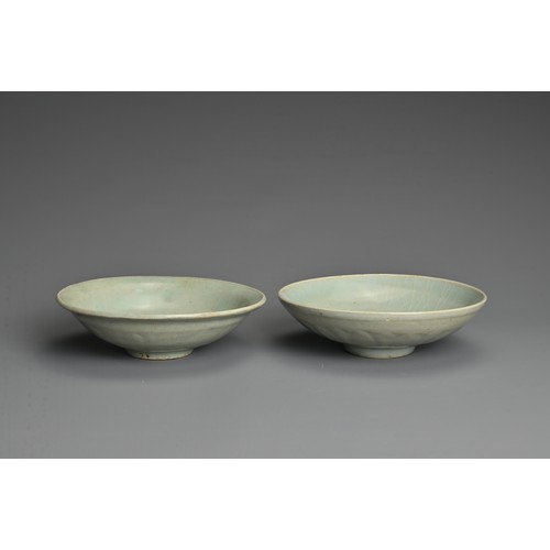 145 - TWO CHINESE QINGBAI WARE PORCELAIN BOWLS, YUAN DYNASTY (1279-1368). Each thickly potted with carved ... 