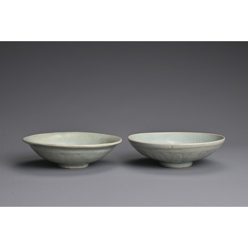 145 - TWO CHINESE QINGBAI WARE PORCELAIN BOWLS, YUAN DYNASTY (1279-1368). Each thickly potted with carved ... 