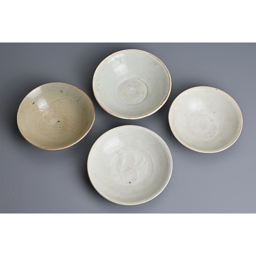 141 - FOUR CHINESE QINGBAI WARE PORCELAIN BOWLS, SONG DYNASTY (960-1279). Each of varied designs sizes. Tw... 