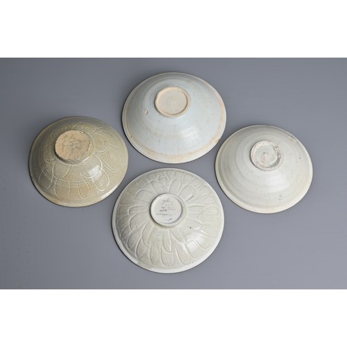 141 - FOUR CHINESE QINGBAI WARE PORCELAIN BOWLS, SONG DYNASTY (960-1279). Each of varied designs sizes. Tw... 