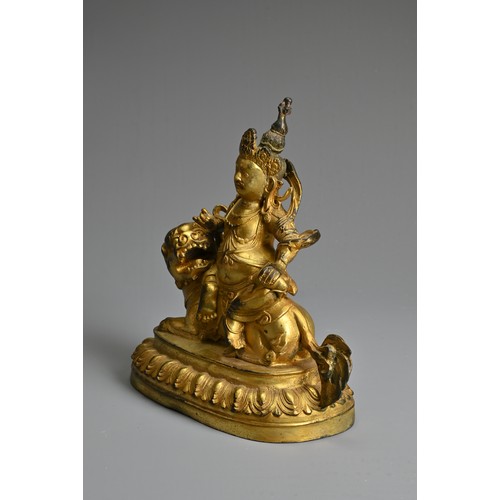 181 - A SINO-TIBETAN GILT-BRONZE FIGURE OF VAISHRAVANA, cast seated atop a lion holding a rat in his left ... 