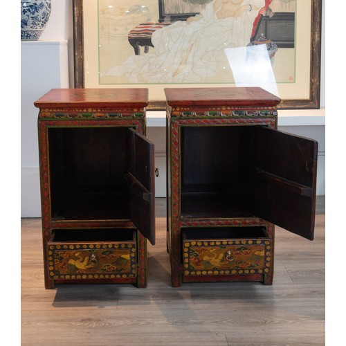 211 - PAIR OF EARLY 20TH CENTURY TIBETAN POLYCHROME LACQUERED CABINETS, of square form each with a planked... 