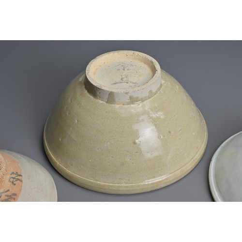 132 - THREE CHINESE QINGBAI WARE BOWLS, SONG / YUAN DYNASTY. Each of varying sizes and design. Two with pa... 