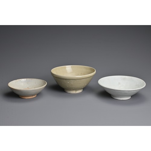 132 - THREE CHINESE QINGBAI WARE BOWLS, SONG / YUAN DYNASTY. Each of varying sizes and design. Two with pa... 