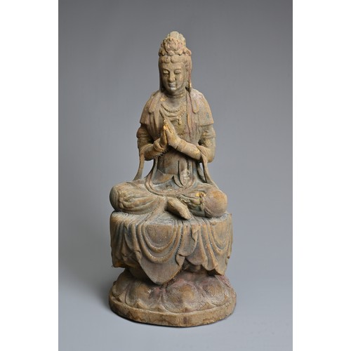 178 - A CHINESE OR SOUTH EAST ASIAN CARVED WOOD, COLD-PAINTED AND GILT FIGURE OF A SEATED BODHISATTVA OR G... 