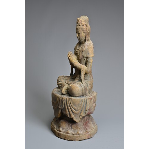 178 - A CHINESE OR SOUTH EAST ASIAN CARVED WOOD, COLD-PAINTED AND GILT FIGURE OF A SEATED BODHISATTVA OR G... 