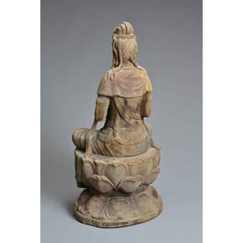 178 - A CHINESE OR SOUTH EAST ASIAN CARVED WOOD, COLD-PAINTED AND GILT FIGURE OF A SEATED BODHISATTVA OR G... 