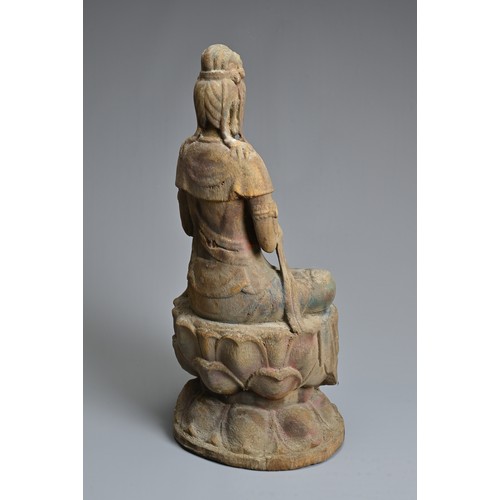 178 - A CHINESE OR SOUTH EAST ASIAN CARVED WOOD, COLD-PAINTED AND GILT FIGURE OF A SEATED BODHISATTVA OR G... 